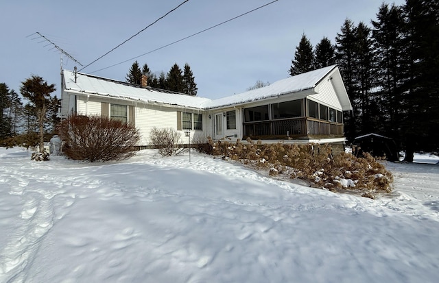 view of front of house featuring a sunroom