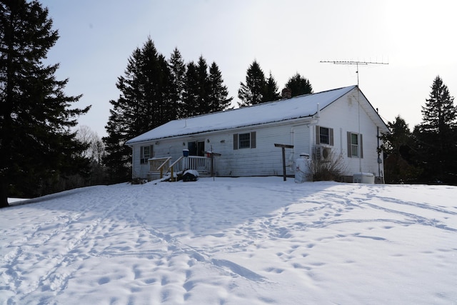 view of snow covered house