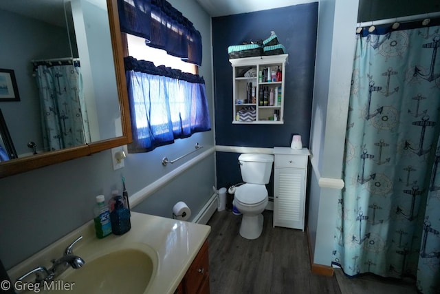 bathroom featuring a baseboard heating unit, a shower with shower curtain, vanity, wood-type flooring, and toilet