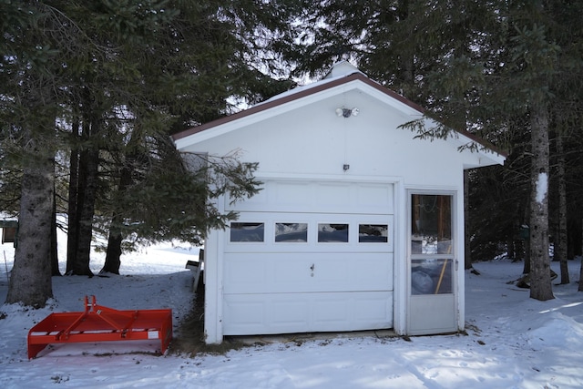 view of snow covered garage