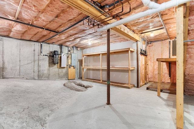 unfinished basement featuring electric panel