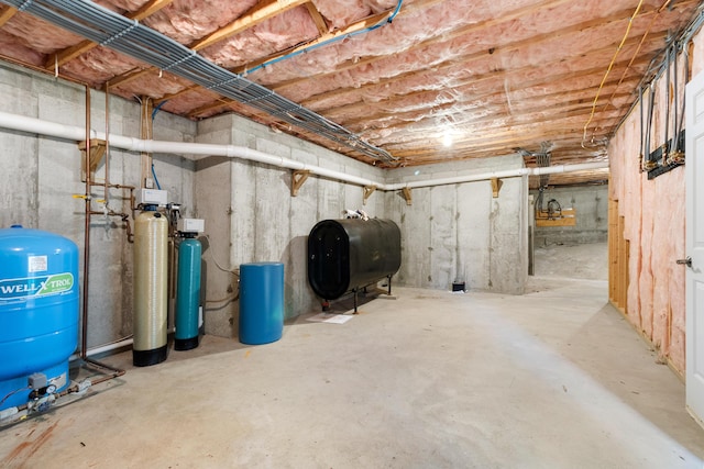 unfinished basement featuring heating fuel