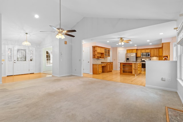 unfurnished living room featuring recessed lighting, light carpet, ceiling fan, and baseboards