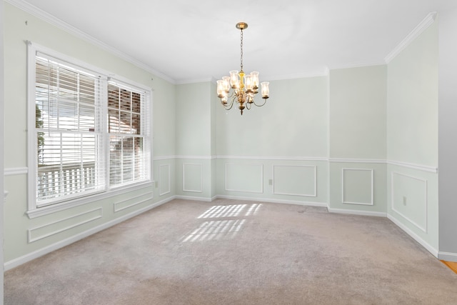 unfurnished room with ornamental molding, light carpet, a decorative wall, and an inviting chandelier