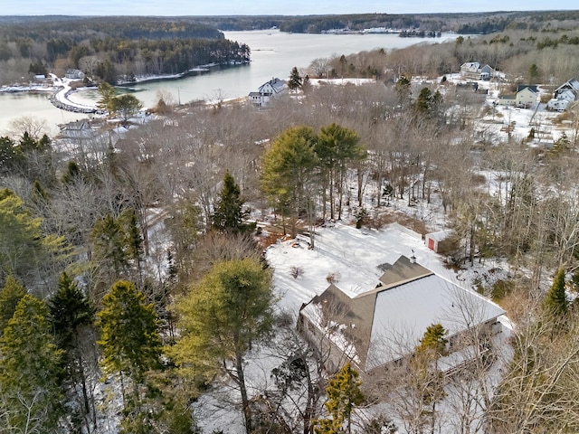 snowy aerial view featuring a water view