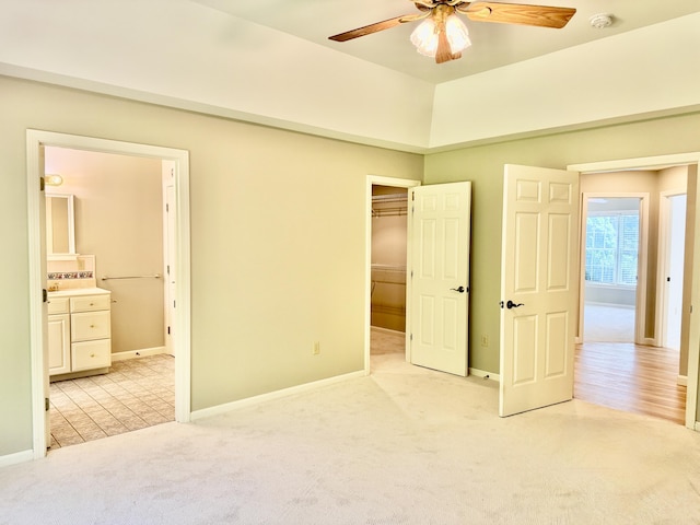 18 Patricia Ln, Saint George, ME 04859 - unfurnished bedroom featuring light colored carpet, baseboards, connected bathroom, a closet, and ceiling fan