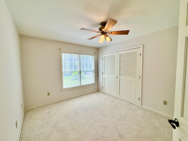18 Patricia Ln, Saint George, ME 04859 - unfurnished bedroom with carpet flooring, baseboards, a closet, and ceiling fan