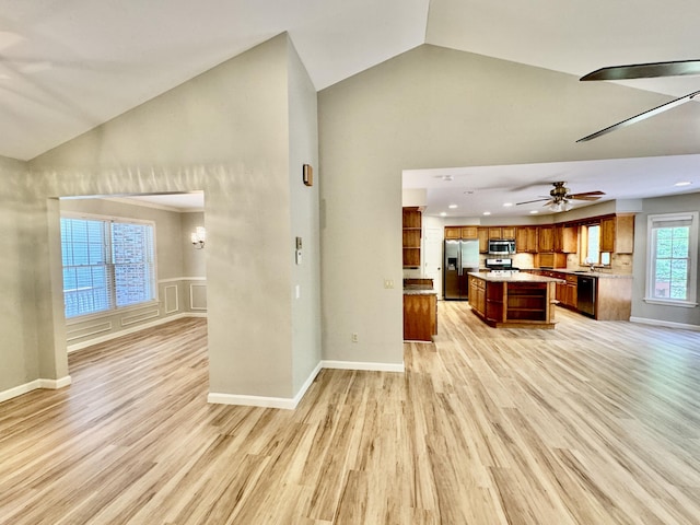 18 Patricia Ln, Saint George, ME 04859 - unfurnished living room featuring light wood-type flooring, high vaulted ceiling, ceiling fan, baseboards, and recessed lighting