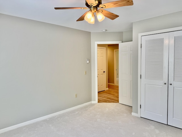 18 Patricia Ln, Saint George, ME 04859 - unfurnished bedroom with light colored carpet, baseboards, a closet, and a ceiling fan