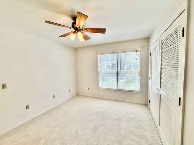 18 Patricia Ln, Saint George, ME 04859 - unfurnished bedroom with light colored carpet, baseboards, a closet, and a ceiling fan