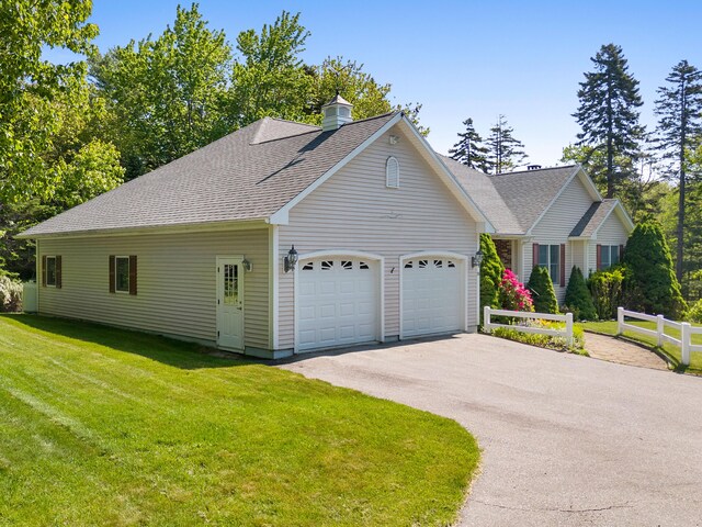 18 Patricia Ln, Saint George, ME 04859 - view of front of home featuring a garage, driveway, a chimney, and a shingled roof