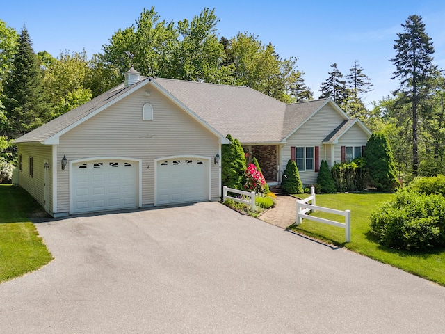 18 Patricia Ln, Saint George, ME 04859 - view of front of property with asphalt driveway, a front yard, a garage, and roof with shingles