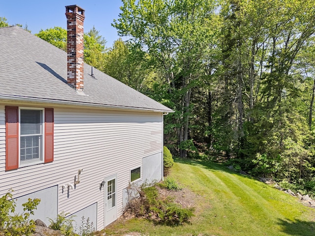 18 Patricia Ln, Saint George, ME 04859 - view of property exterior featuring a chimney, a lawn, and a shingled roof