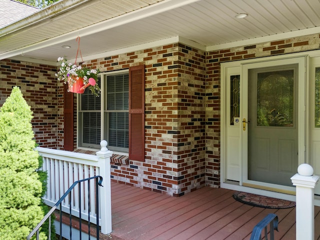 18 Patricia Ln, Saint George, ME 04859 - doorway to property featuring a porch and brick siding