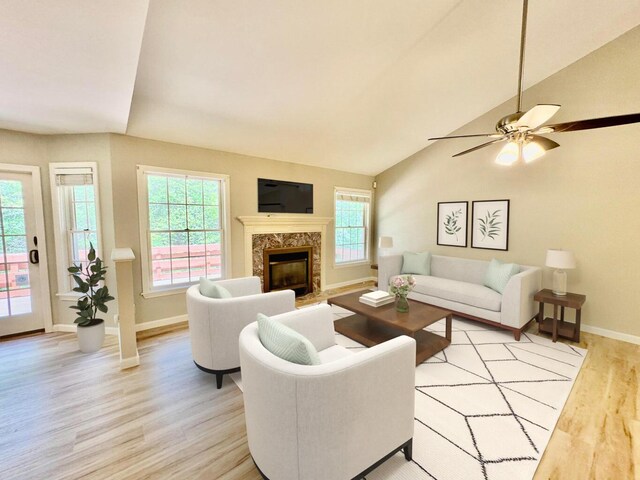 18 Patricia Ln, Saint George, ME 04859 - living room with light wood-style flooring, a fireplace, vaulted ceiling, and a ceiling fan
