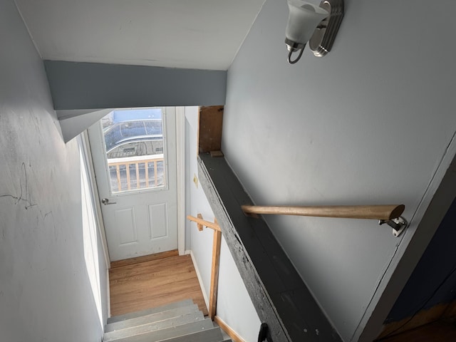 stairway featuring hardwood / wood-style floors