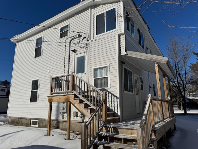 view of snow covered house