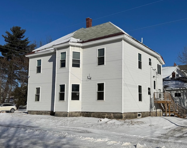 view of snow covered property