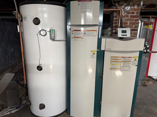 utility room featuring water heater