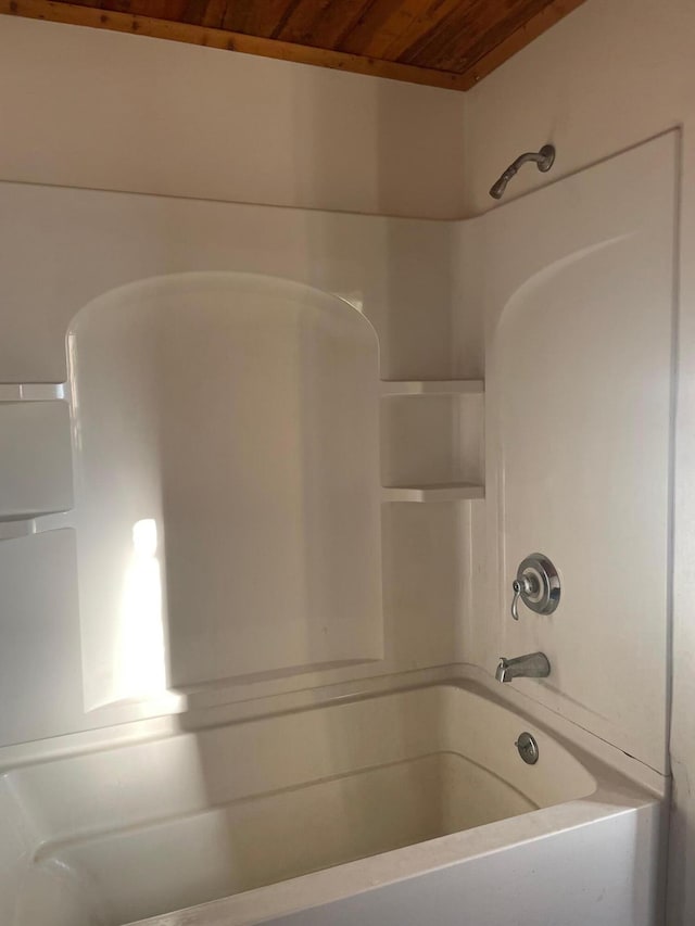 bathroom featuring shower / bathtub combination and wooden ceiling