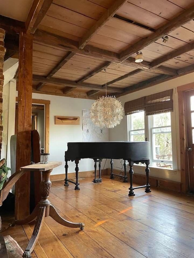 misc room featuring beam ceiling, wood-type flooring, wood ceiling, and baseboards