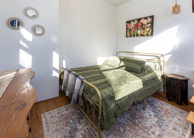 bedroom featuring hardwood / wood-style flooring