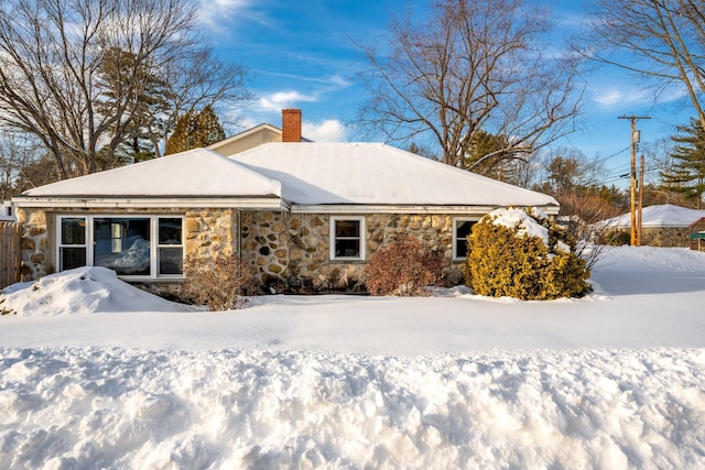 view of snow covered house