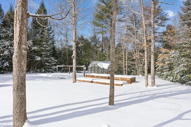 view of yard covered in snow