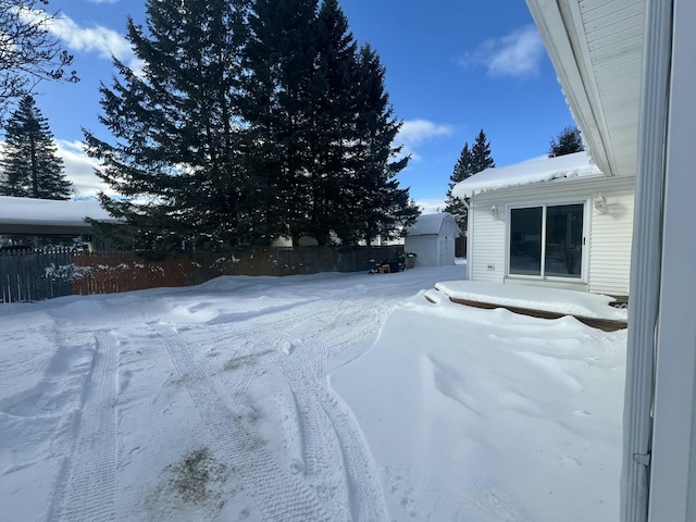 view of yard layered in snow