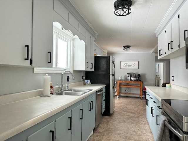 kitchen with white cabinetry, sink, crown molding, and appliances with stainless steel finishes