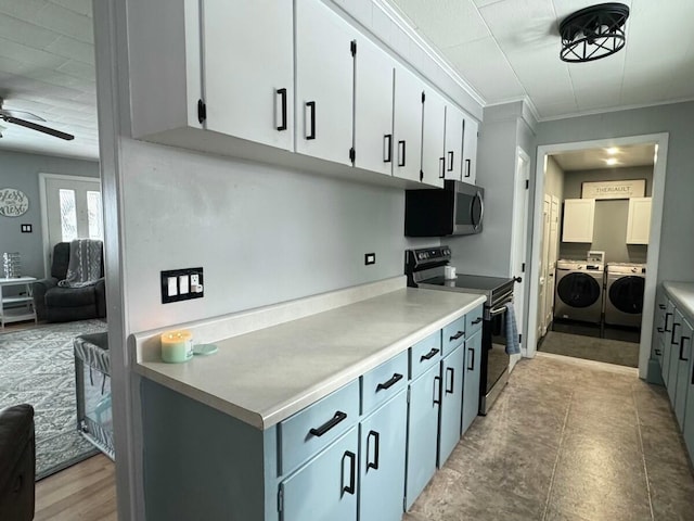 kitchen with gray cabinetry, white cabinetry, appliances with stainless steel finishes, ceiling fan, and washer and clothes dryer