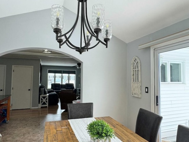 dining area with ceiling fan and vaulted ceiling