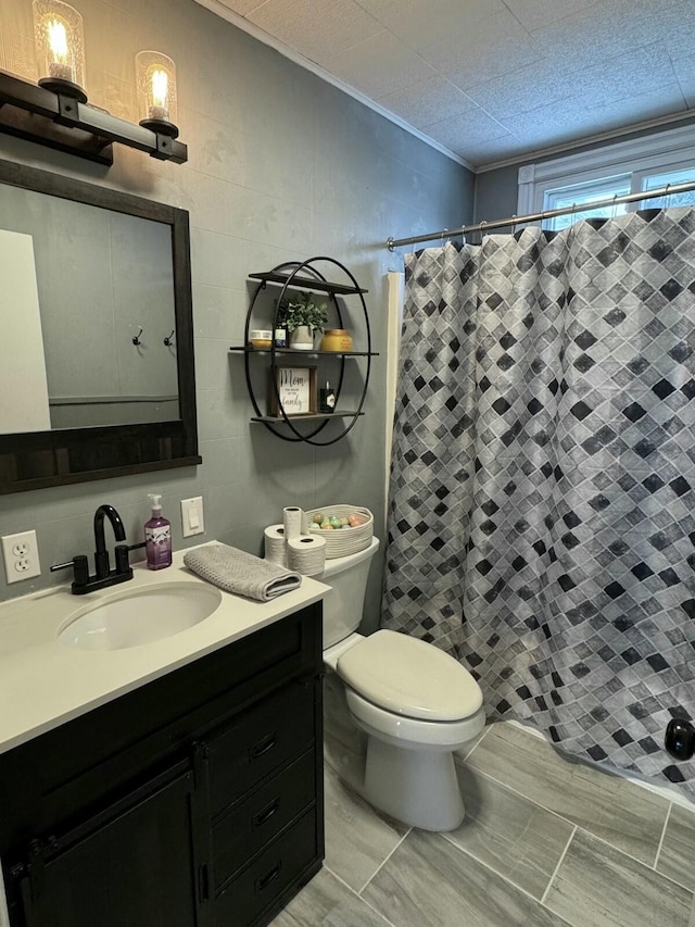 bathroom with vanity, a shower with curtain, and toilet