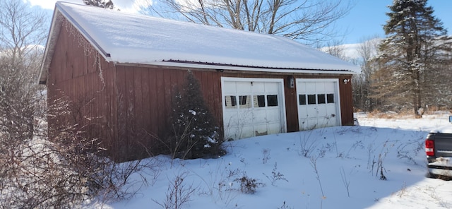 view of snow covered garage