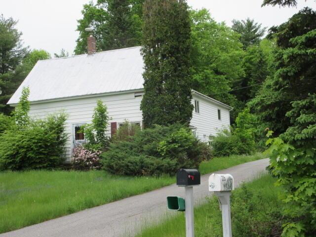 236 Frenchs Mill Rd, Sangerville, ME 04479 - view of home's exterior with a chimney