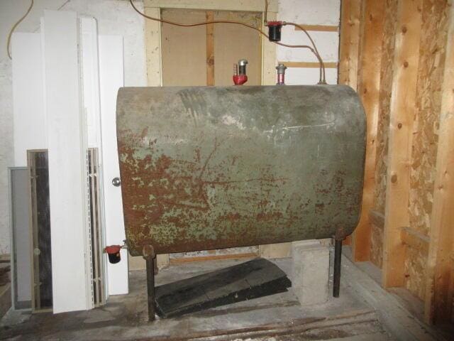 236 Frenchs Mill Rd, Sangerville, ME 04479 - utility room featuring oil tank