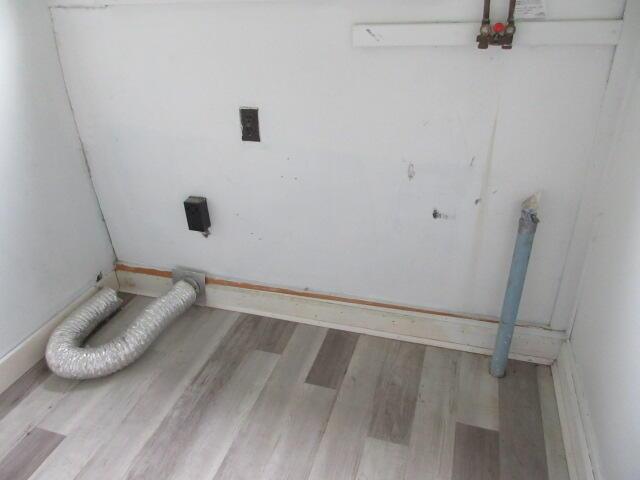 236 Frenchs Mill Rd, Sangerville, ME 04479 - laundry area with wood finished floors and baseboards