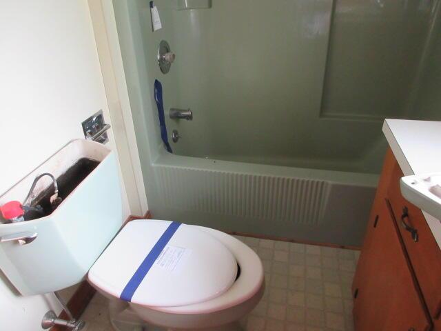 236 Frenchs Mill Rd, Sangerville, ME 04479 - full bathroom with vanity, toilet, and shower / washtub combination