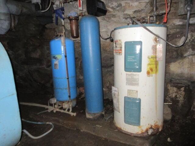 236 Frenchs Mill Rd, Sangerville, ME 04479 - utility room featuring water heater
