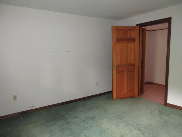 236 Frenchs Mill Rd, Sangerville, ME 04479 - unfurnished bedroom featuring carpet and baseboards