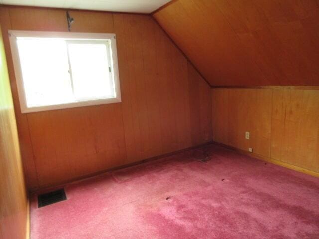 236 Frenchs Mill Rd, Sangerville, ME 04479 - bonus room featuring lofted ceiling, carpet, and wooden walls