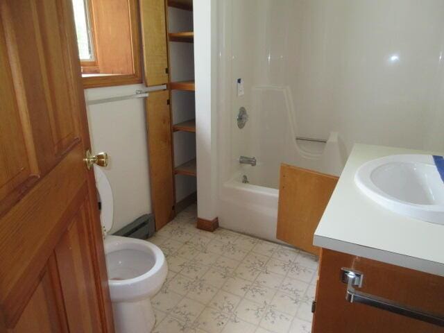 236 Frenchs Mill Rd, Sangerville, ME 04479 - bathroom with tile patterned floors, toilet, vanity, and shower / tub combination