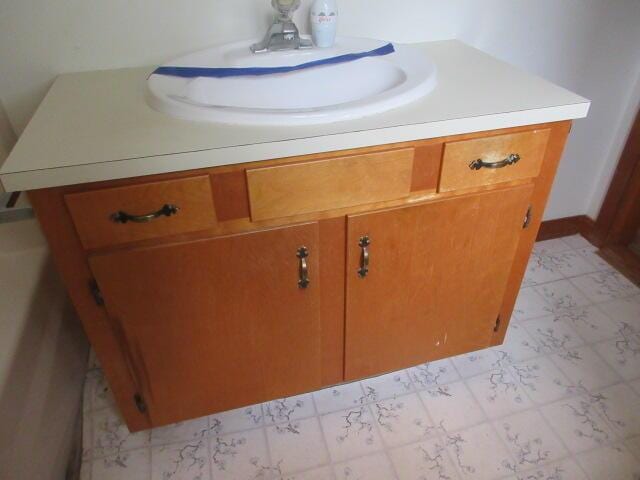 236 Frenchs Mill Rd, Sangerville, ME 04479 - bathroom featuring tile patterned floors and vanity