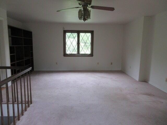 236 Frenchs Mill Rd, Sangerville, ME 04479 - empty room featuring light colored carpet and a ceiling fan