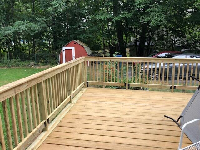 deck featuring a storage shed