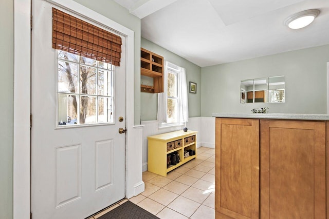 doorway featuring light tile patterned floors