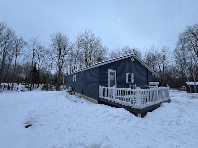 exterior space featuring a wooden deck