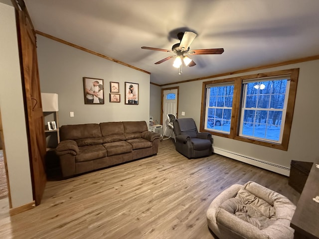 living room featuring crown molding, a baseboard heating unit, ceiling fan, and light wood-type flooring