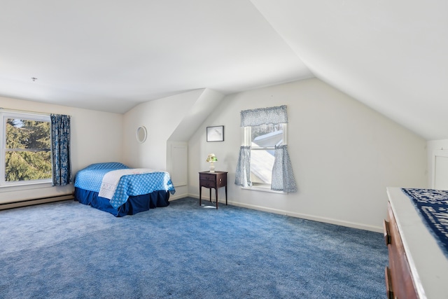 carpeted bedroom with vaulted ceiling and a baseboard heating unit