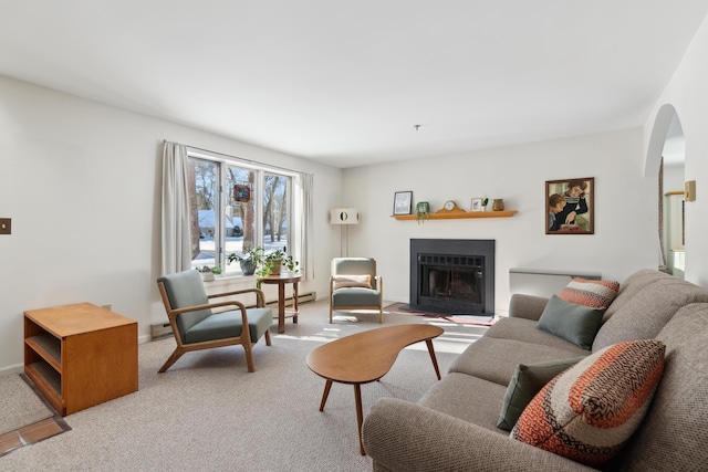 carpeted living room featuring baseboard heating